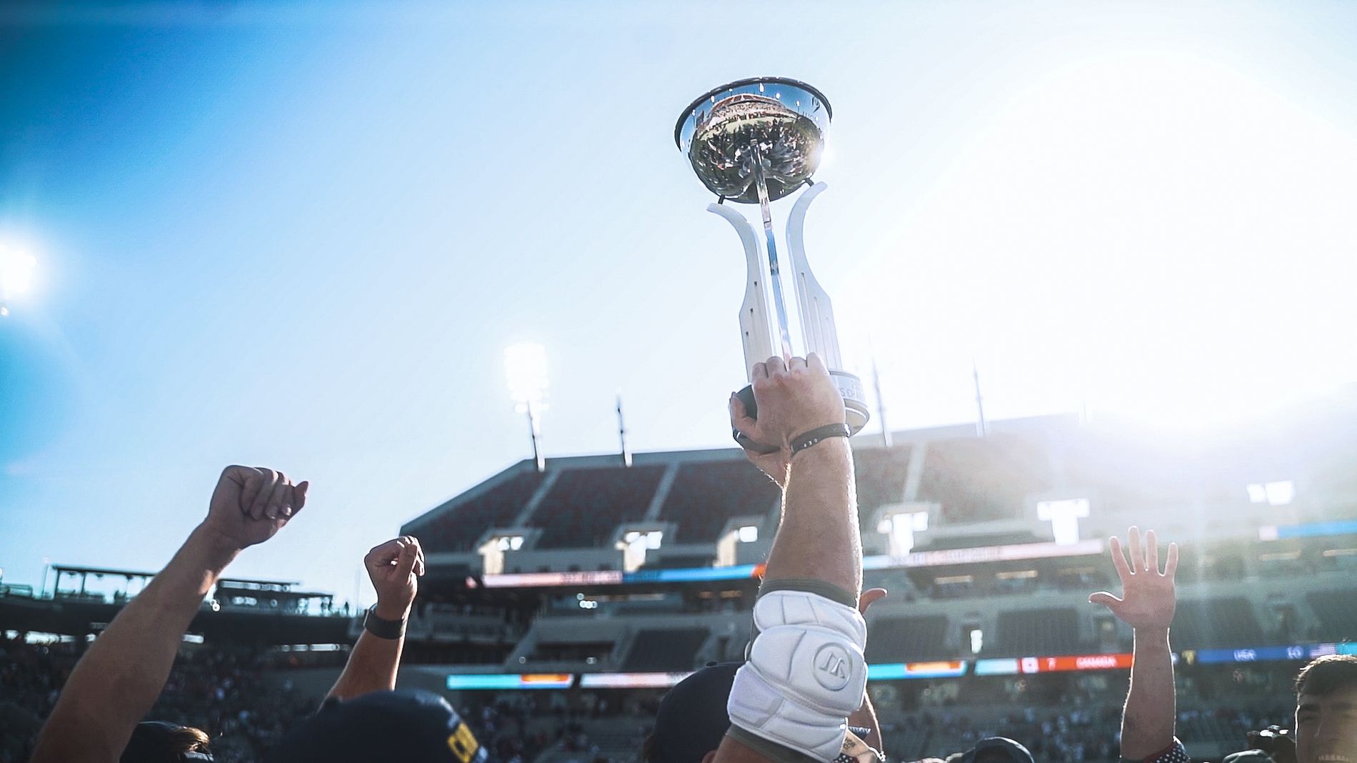 A trophy raised at a stadium championship